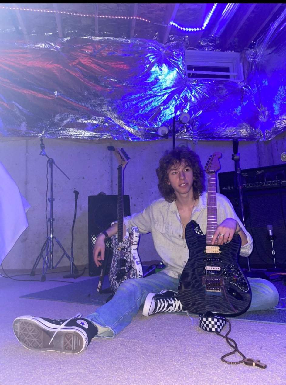 Ayden Luke with his guitar